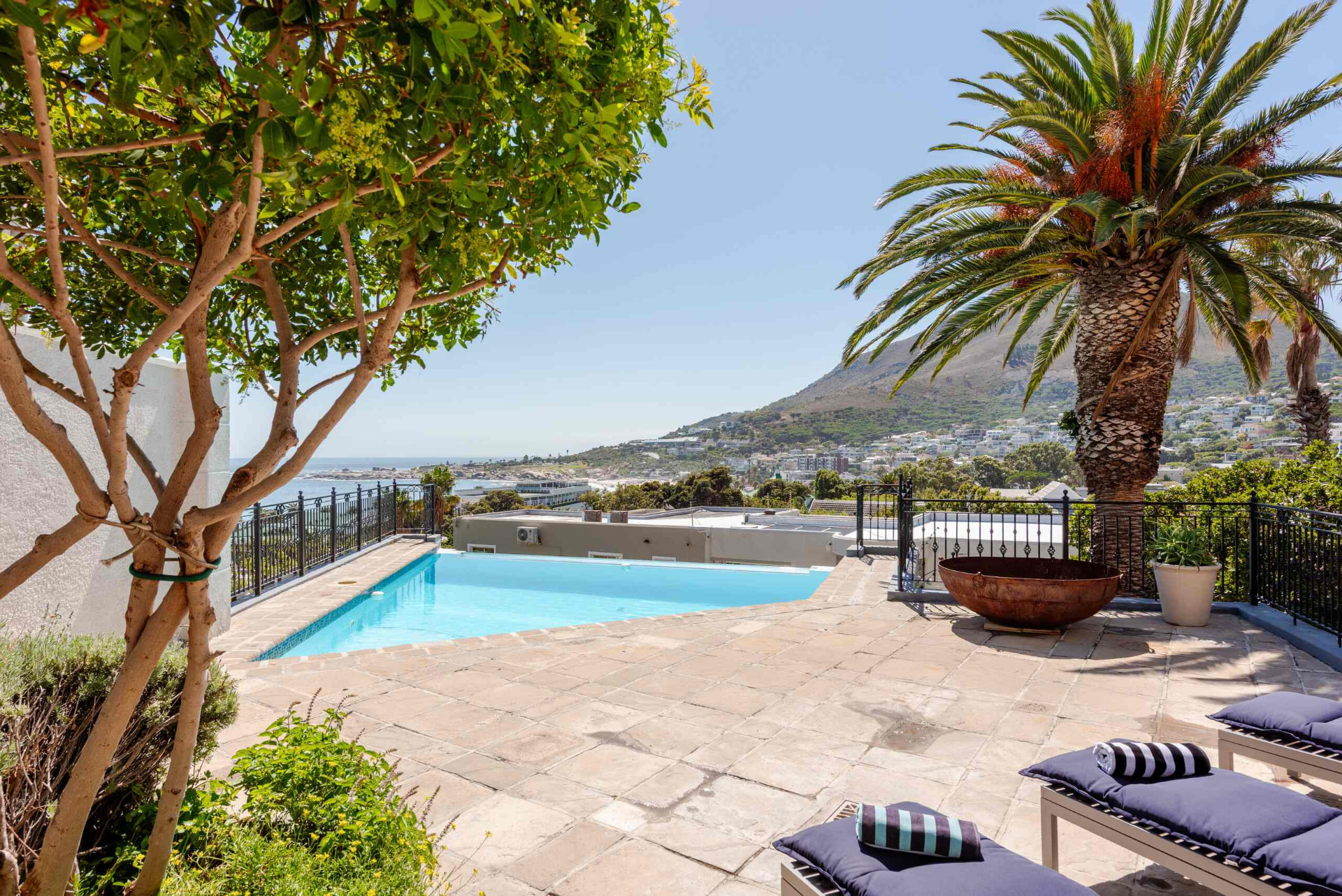 Pool terrace at Feeling Azure looking out over Camps Bay and the Atlantic Ocean